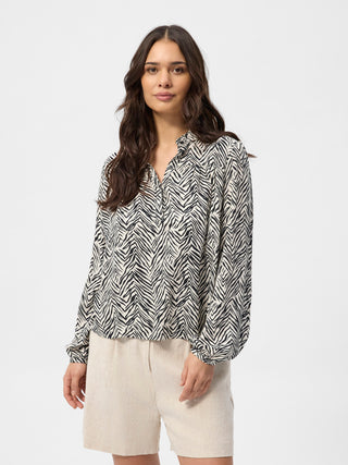 Sort‑hvid zebra‑stribet RedGreen dametop med V‑udskæring, lange ærmer med elastikmanchetter og løs pasform